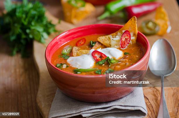 A Bowl Of Ranchero Chicken Topped With Chips Stock Photo - Download Image Now - Soup, Tortilla Soup, Nacho Chip