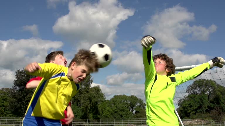 Boys scoring three goals in Kid's Soccer / Football match