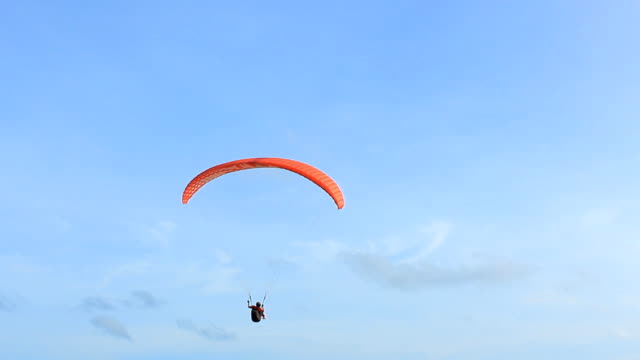 Silhouette Of A Paraglider