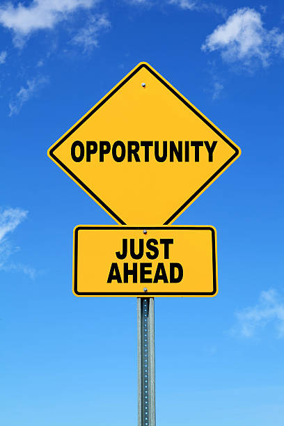 istock Yellow motivational road sign opportunity just ahead 457330143