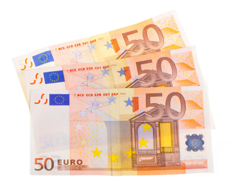Some isolated 50 euro banknotes on a white background