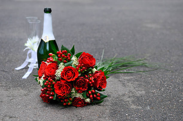 istock Bottle of champagne, two glasses and bouquet 457330923