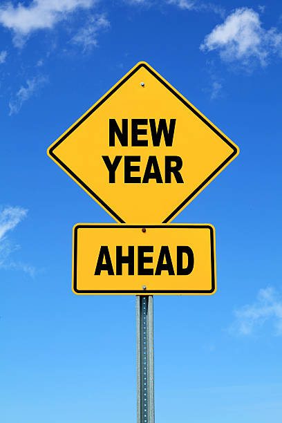 istock Yellow road sign new year ahead 457330973