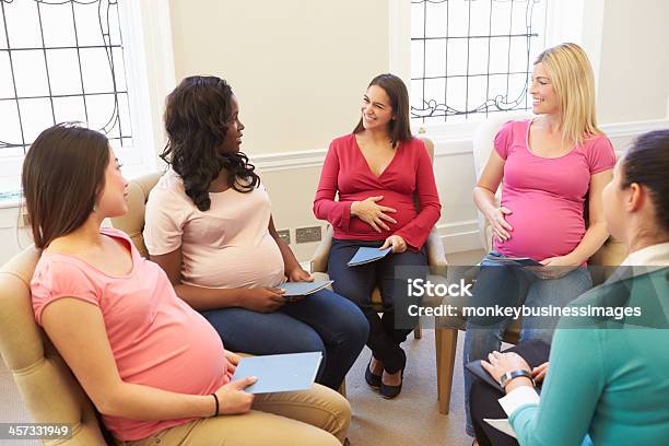 Pregnant Women Meeting At Ante Natal Class Stock Photo - Download Image Now - Pregnant, Discussion, Meeting