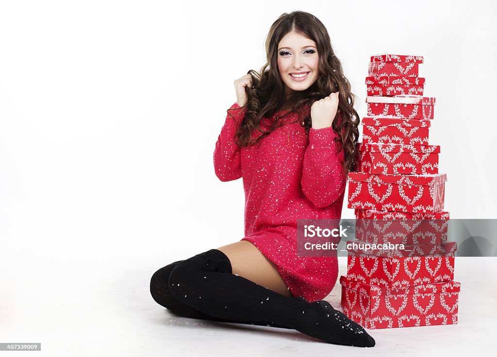 woman with many red gift boxes smiling woman with many gift boxes isolated on white Adult Stock Photo