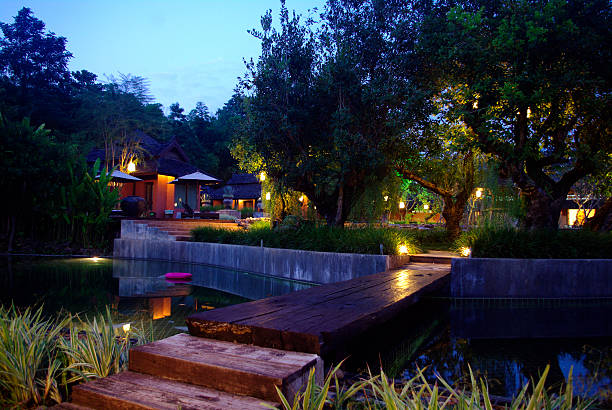 istock tropical resort architecture lighting, wooden bridge 457344159