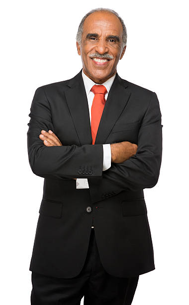 istock Latin business executive smiling with arms crossed 457344585