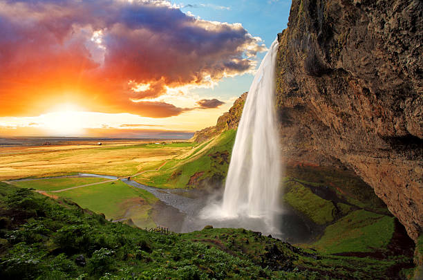 Waterfall, Iceland - Seljalandsfoss Seljalandsfoss is one of the most beautiful waterfalls on the Iceland. It is located on the South of the island. With a rainbow. natural landmark photos stock pictures, royalty-free photos & images