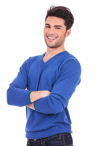 istock casual young man standing with his hands crossed 457381999