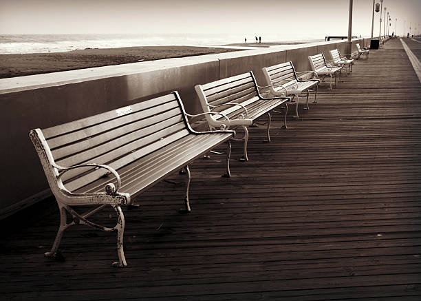 istock Boardwalk and Benches By the Beach 457385641