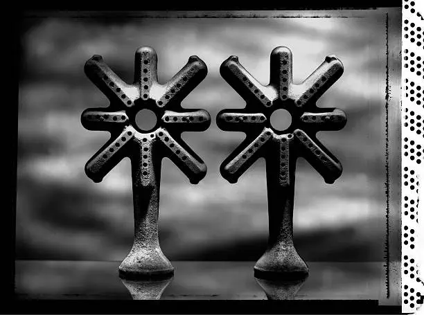 An abstract photos of gas valves from an antique stove