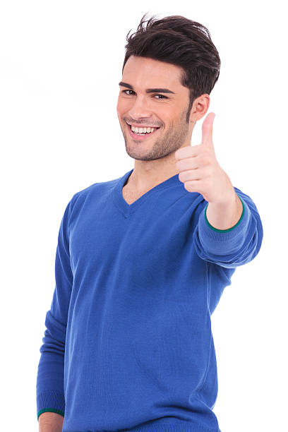 istock smiling man making the ok thumbs up sign 457388057
