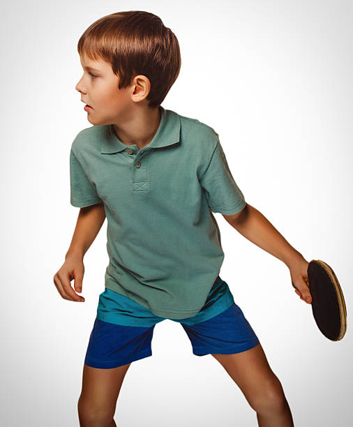 istock boy blond man table tennis playing ping pong 457389387