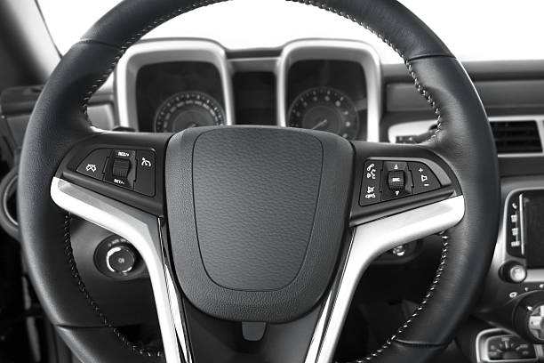 Audio Control Buttons on Steering Wheel of Modern Car.Controls are located on the steering wheel to adjust the volume for music or blue tooths Speakerphone to control. Multimedia functions for the play stop, start, and skip individual music title run. Retrieving information about the car technic and state