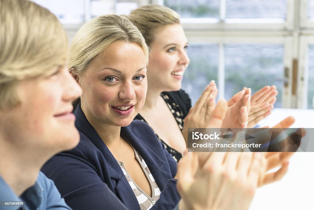 office workers applauding at the meeting Achievement Stock Photo