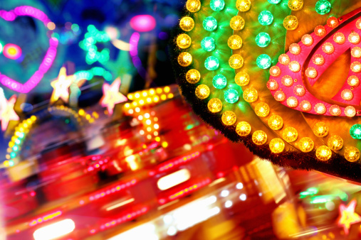 Happy funfair lighting with vibrant color and blinking neons