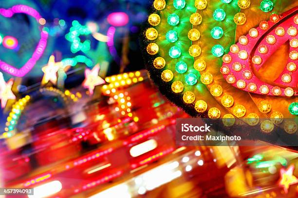 Colorful Amusement Park Funfair Lighting With Vibrant Light Bulbs Background Stock Photo - Download Image Now
