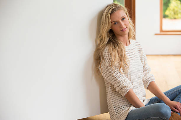istock Young Girl Leaning Against Wall 457394155