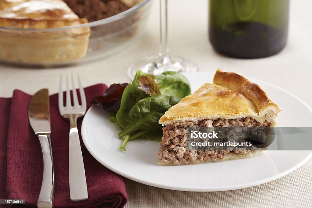 Traditional meat pie on a dish TourtiÃ¨re Canadian traditional meat pie on a dish Baked Stock Photo