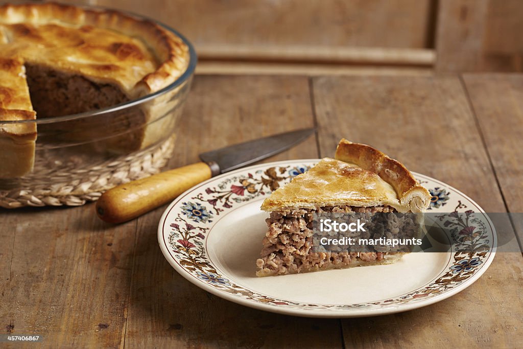 Plated slice of traditional meat pie TourtiÃ¨re Canadian traditional meat pie on a dish Quebec Stock Photo