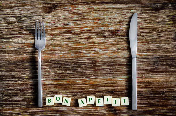 istock Silverware on the vintage table and Bon apetit sign 457407069