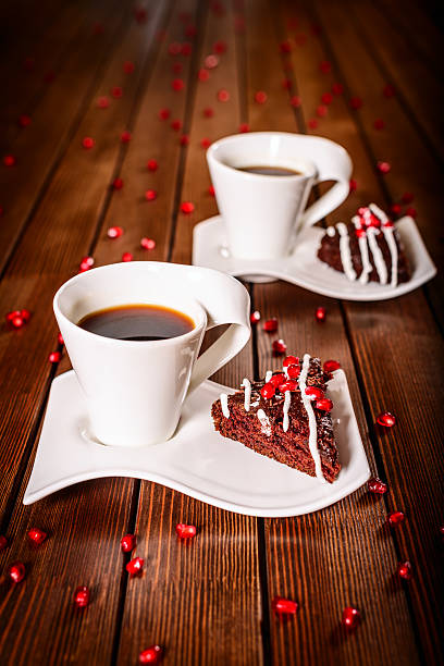 istock Christmas chocolate cake dessert with pomegranate and coffee 457410429