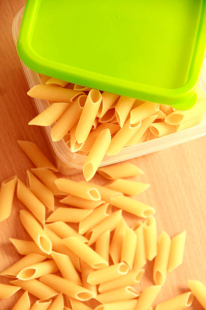 istock Dried pasta preserve in green plastic box 457411305
