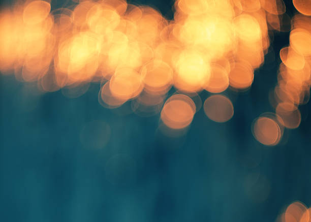 Orange lights. Blue bokeh background.Orange lights. blue yellow lights stock pictures, royalty-free photos & images