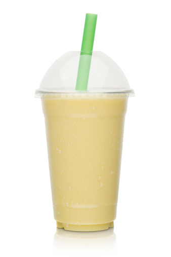 banana milkshake isolated on a white background