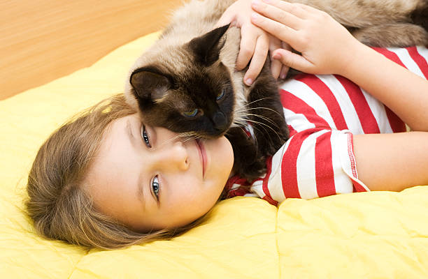 istock girl and cat 457416009