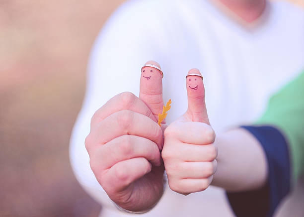 istock Funny thumbs with wedding rings 457417589