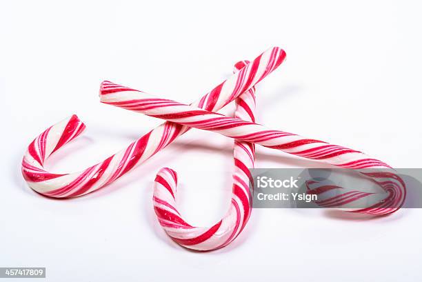 Three Twisted Red And White Candy Canes Stock Photo - Download Image Now - Candy, Candy Cane, Christmas