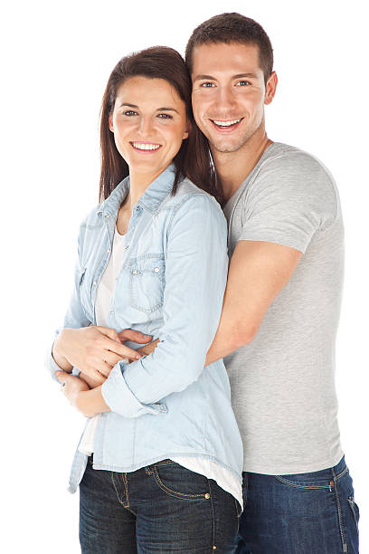 istock Cheerful young couple standing on white background 457419401