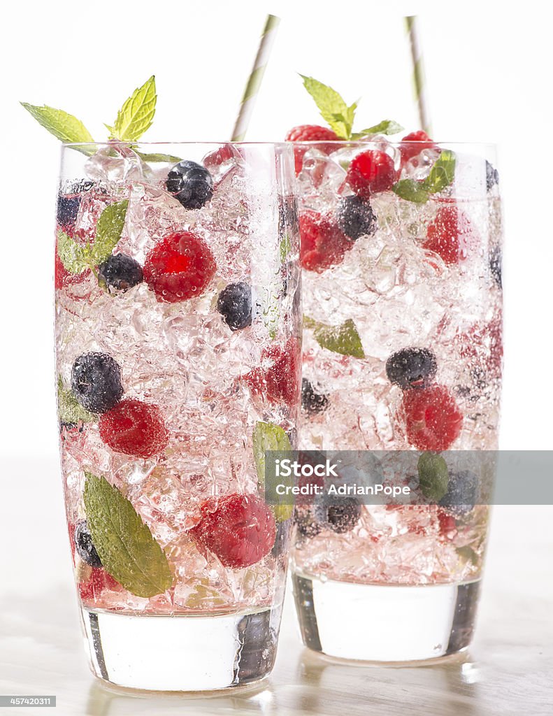 blueberry raspberry mint soda blueberry raspberry mint drink in glass with ice and straw Berry Fruit Stock Photo