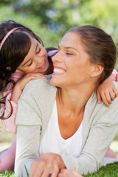 istock Mother with her head turned back smiling at daughter 457422435