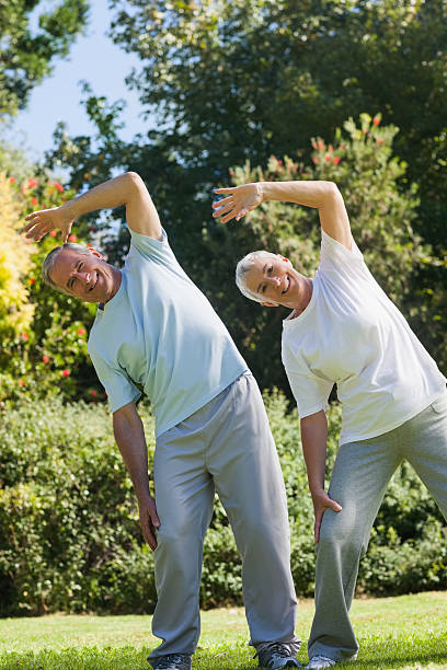 istock Happy elderly couple exercising together 457423005