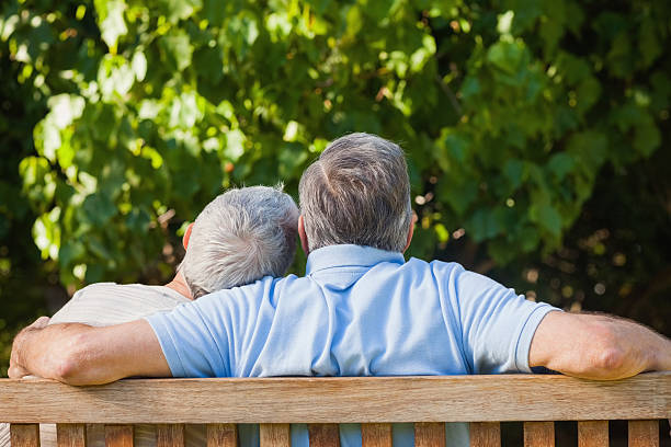 istock Elderly woman resting her head on husbands shoulder 457423037