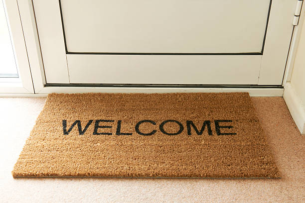 istock Welcome Mat Inside Doorway Of Home 457423339
