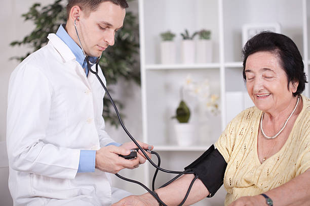 istock Senior woman with doctor. 457424703