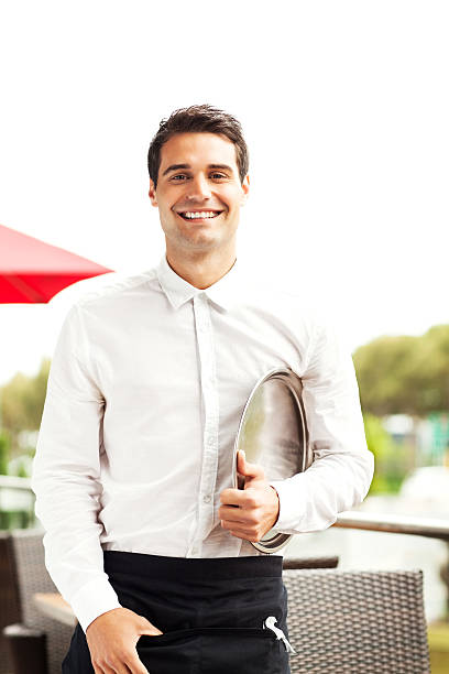 istock Confident Waiter With Serving Tray Smiling In Restaurant 457425449