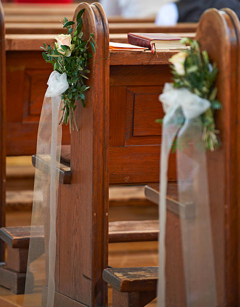 istock wooden benches in church 457427055