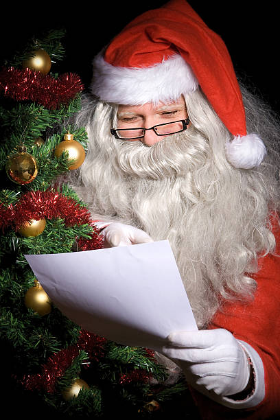 istock Santa Claus reading wish list 457438629