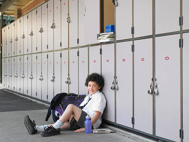 istock Happy Boy Leaning Against School Lockers 457442637