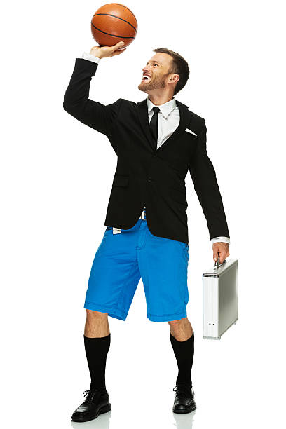 istock Smiling man holding basketball and briefcase 457443209