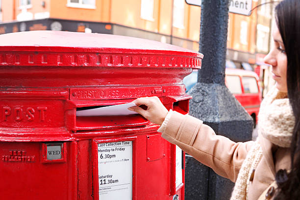 istock Girl sending a letter in London 457445791