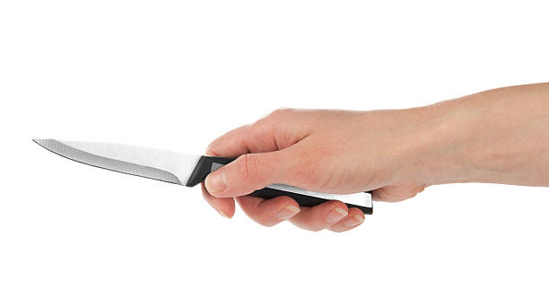 istock Small kitchen knife in the female hand 457448797
