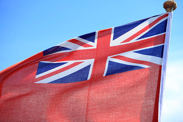 istock British maritime red ensign flag blue sky 457451757