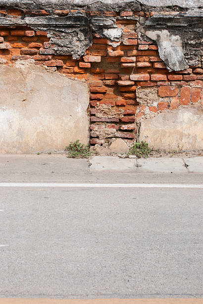 istock Old Brick Wall and Road Street 457451885