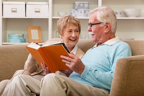 istock Seniors looking through Photo album 457453457