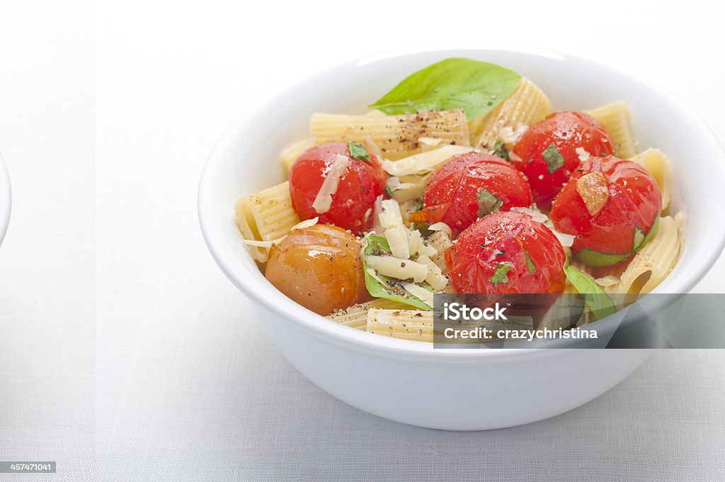 Rigatoni with tomato and basil Rigatoni pasta with cherry tomatoes, basil, balsamic vinegar, and parmesan cheese. Balsamic Vinegar Stock Photo